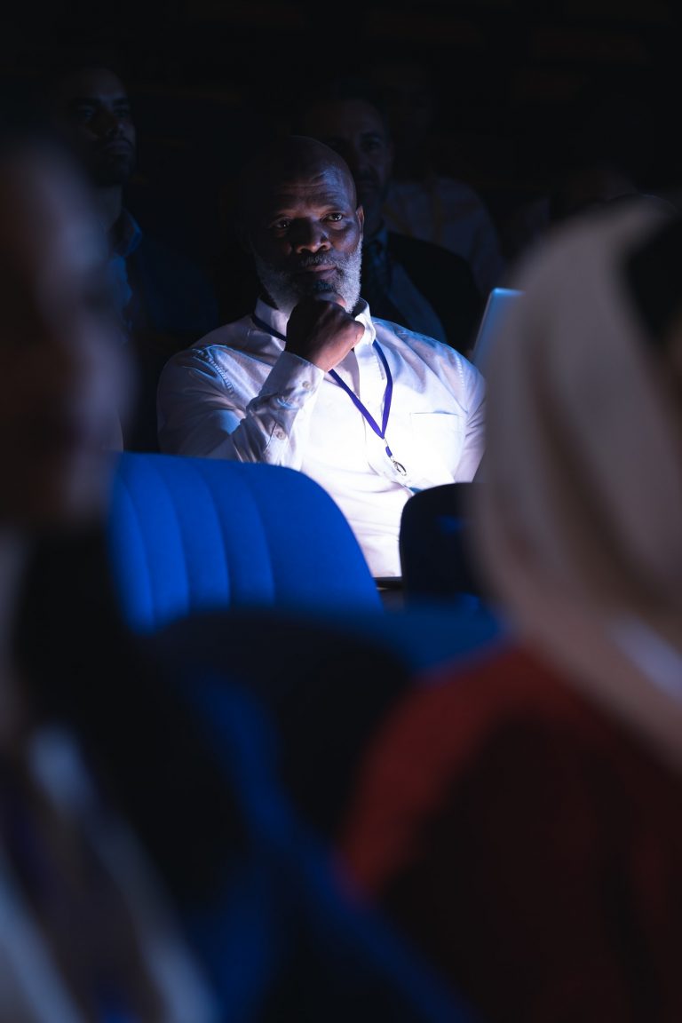 Businessman looking and thinking in the auditorium